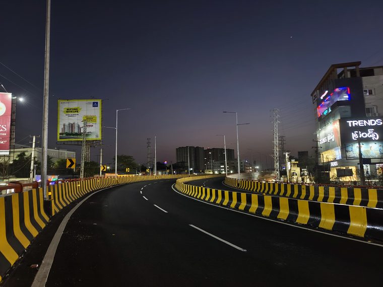 A multi-level flyover curving across a Hyderabad junction