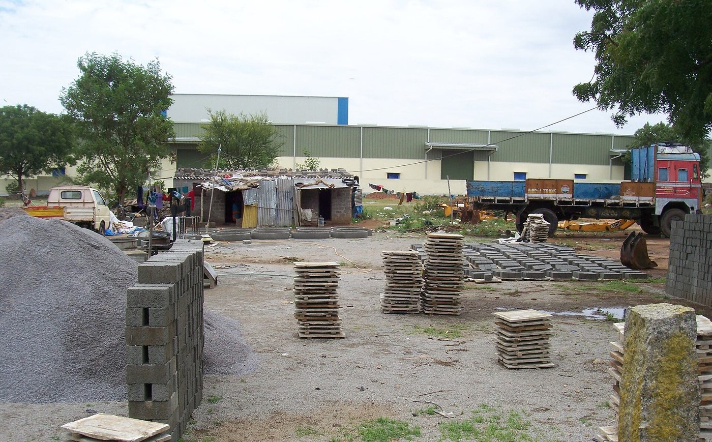 An industrial plant with storage tanks and chimneys