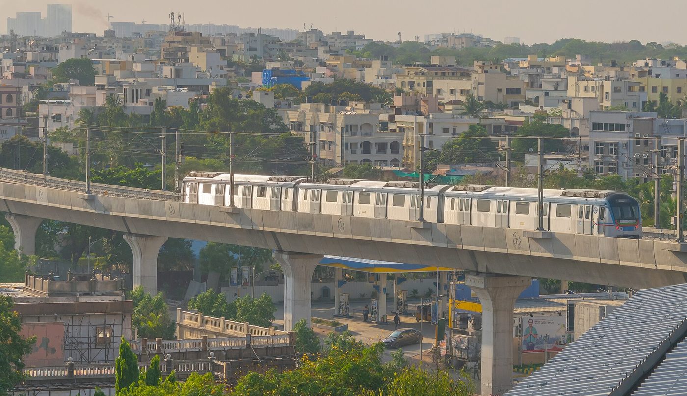 A Hyderabad Metro train crossing Ameerpet station on the blue line