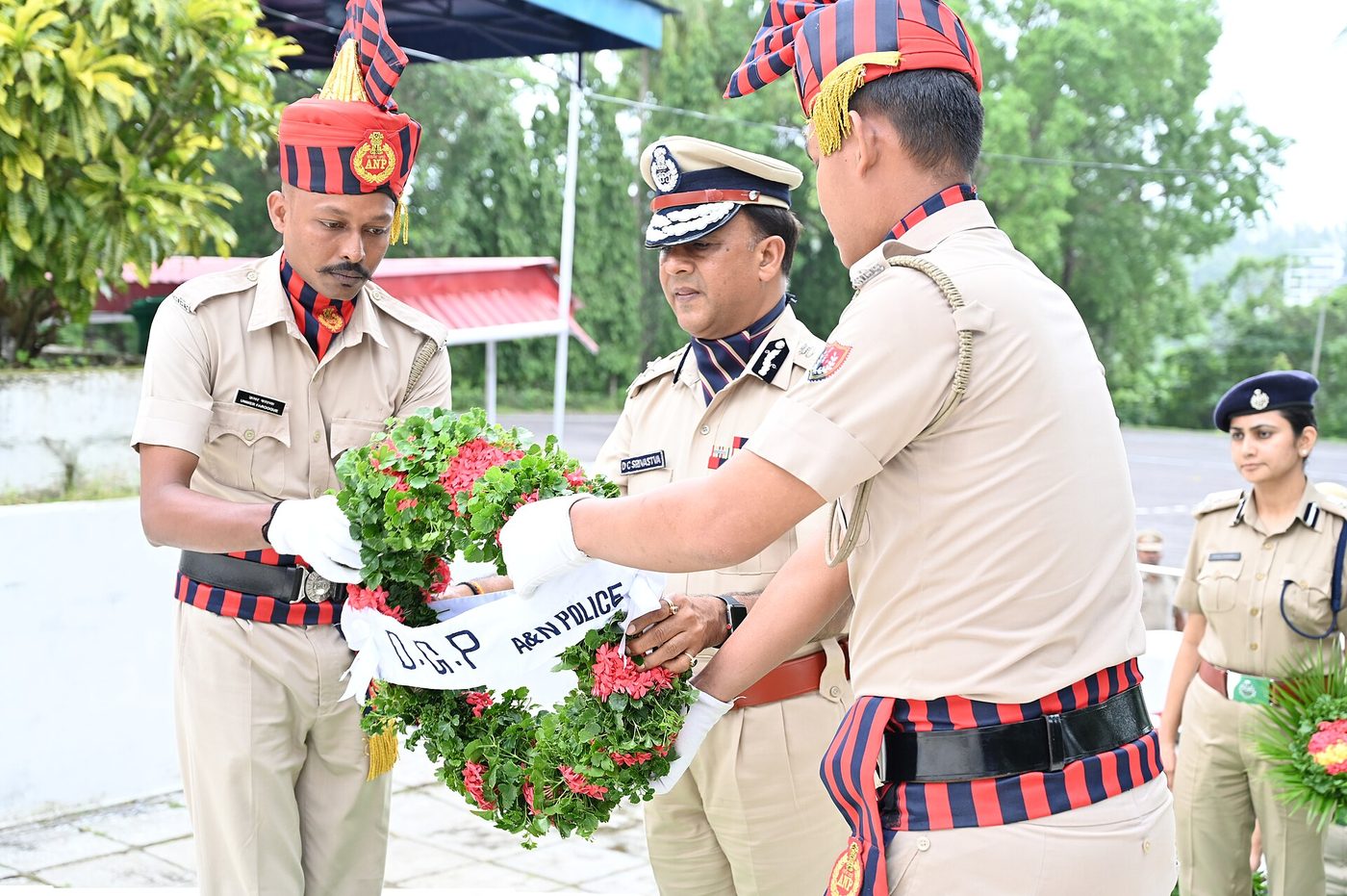 Police personnel lined up on parade at a police line