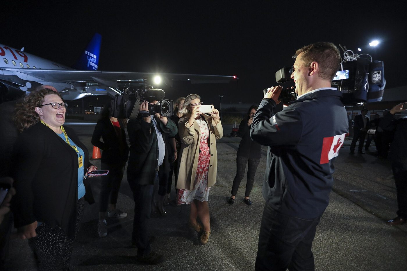 Reporters and cameras set up at a press conference